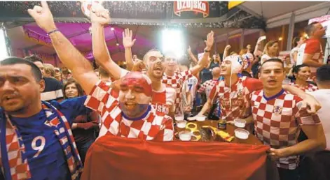  ?? GETTY ?? Croatia's supporters and Dejan Lovren (below) hope they're in store for one more World Cup celebratio­n.