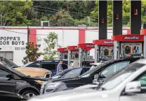  ?? Chris Granger / Associated Press ?? Long lines fill up the lot at a gas station in Jefferson, La., as people prepare for the arrival of Hurricane Ida.