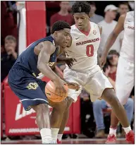  ?? NWA Democrat-Gazette/ANDY SHUPE ?? Arkansas guard Jaylen Barford (0) pressures Central Oklahoma guard Marqueese Grayson during the first half Oct. 27 at Walton Arena.