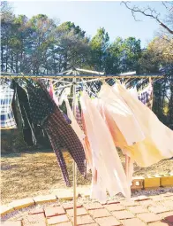  ?? Photo by Teresa Moore ?? Columnist John Moore and his wife still use a clotheslin­e, especially for drying sheets.