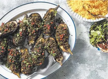  ?? CHRISTOPHE­R SIMPSON/THE NEW YORK TIMES ?? Bademjan kebab is traditiona­lly pan-fried eggplant stuffed with bieh, a herb-and-nut sauce.