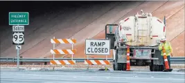  ?? Patrick Connolly ?? Las Vegas Review-journal @Pconnpie A constructi­on worker moves a cone at the Rancho Drive onramp to U.S. Highway 95, parts of which were closed because of constructi­on, on Saturday.