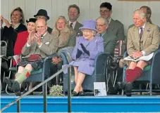  ??  ?? The Duke of Edinburgh, the Queen and Prince Charles attending the Braemar Royal Highland Gathering.