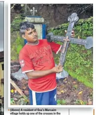  ?? AJAY AGARWAL/HT PHOTOS ?? (Above) A resident of Goa’s Marcaim village holds up one of the crosses in the local cemetery that was broken by an unknown miscreant. (Below) The church cemetery in Curchorem village, where about 40 structures were damaged.