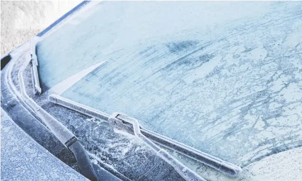  ?? — ISTOCK.COM VIA GETTY IMAGES ?? Clearing frost and ice from the windshield is essential for safe driving.