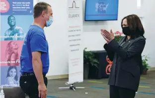  ?? COVID (Jonathan Ernst/Reuters) ?? US VICE PRESIDENT Kamala Harris applauds a man after he received a shot at a pop-up vaccinatio­n site at the historic Ebenezer Baptist Church in Atlanta on Friday.