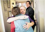  ?? Marie D. De Jesús / Staff photograph­er ?? Teresa Powell embraces her friend Lida Dahm. Powell, an early-stage cancer survivor, is part of a trial aimed at preventing lung cancer from developing.