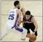  ?? MATT YORK — THE ASSOCIATED PRESS ?? Suns guard Devin Booker drives past Ben Simmons during the second half Saturday. Booker scored 36 points, and Phoenix shot better than 60 percent from the field in a 120-111 win.