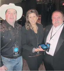  ??  ?? The event’s phenomenal success is thanks in part to the terrific live and silent auction items up for grabs. Pictured, from left, are Elevate Auctions’ John Murray, Renee Rothzen and legendary auctioneer Bill Brown.