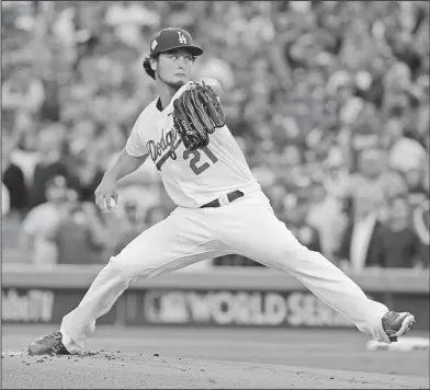  ?? Associated Press ?? Darvish delivers: In this Nov. 1, 2017, file photo, Los Angeles Dodgers starting pitcher Yu Darvish throws during the first inning of Game 7 of baseball's World Series against the Houston Astros in Los Angeles. Perhaps 100 free agents still seek...