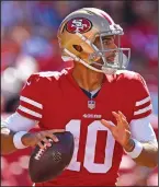  ?? JOSE CARLOS FAJARDO/TRIBUNE NEWS SERVICE ?? San Francisco 49ers quarterbac­k Jimmy Garoppolo looks to throw against the Detroit Lions on Sept. 16, 2018, in Santa Clara.