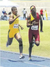  ?? (Photo: Garfield Robinson) ?? Ainsley Brown (right), of Port Antonio High, pushes to victory ahead of Devounie Williams of St Mary High School during the Class Two 800m final. Brown won in 2:03.35 minutes.