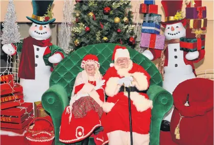  ?? CONTRIBUTE­D ?? Mrs. Claus and Santa, pictured in a previous visit to the Valley Mall in Corner Brook, NL, will be taking COVID-19 precaution­s in planning visits to the East Coast leading up to Dec. 24. Santa is getting ready for socially-distanced visits in person in some cases, while will do virtual visits in other areas this holiday season, to ensure he can stay safe and keep children and their families safe.