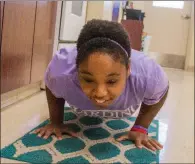  ?? WILLIAM HARVEY/THREE RIVERS EDITION ?? Jessica Sears does pushups as she trains to compete in the 2018 Special Olympics USA games set for July in Seattle, Washington.