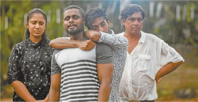  ??  ?? Mourners grieve at the burial on Monday of three members of the same family who were killed in the Easter Sunday bomb blast at St Sebastian’s Church in Negombo,
Sri Lanka.