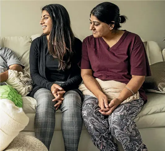  ?? BRADEN FASTIER/STUFF ?? Feroze Mohammed Ditta, 51, is glad to be home after being discharged from hospital. With him, from left, are his daughters Sana Ditta, 21, and Zahra Ditta, 25, and his wife, Gulshad Ditta.