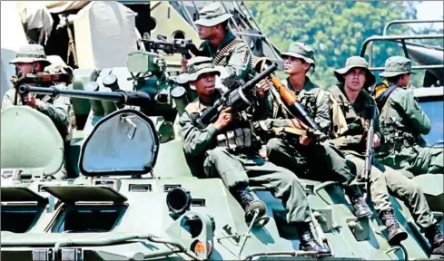  ?? MENDOZA/AFP SCHNEYDER ?? Members of the Venezuelan National Guard take part in a military exercise at Garcia Hevia airport in La Fria, Tachira state on Tuesday.