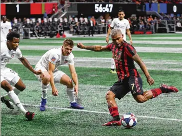  ?? CURTIS COMPTON / CCOMPTON@AJC.COM ?? Atlanta United midfielder Josef Martinez takes a shot on a goal that is blocked by FC Cincinnati during the second half in their match on Sunday in Atlanta. Martinez scored United’s lone goal.