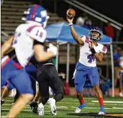  ?? ?? Riverwood quarterbac­k Avery Smith, playing against Johns Creek on Sept. 24, threw for 360 yards and five touchdowns in a 44-15 victory over River Ridge on Friday. Smith, who was 23-of-33 passing, also rushed for 53 yards.