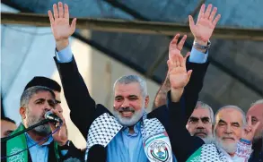  ??  ?? GAZA: File photo shows Hamas leader in the Gaza Strip Ismail Haniya waving to the crowd during a rally in Gaza City. — AFP