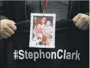  ?? Jeff Chiu Pool photo ?? A MOURNER wears a photo of Stephon Clark, 22, during his funeral Thursday in Sacramento. Clark was fatally shot by two police officers on March 18.