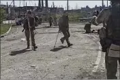  ?? RUSSIAN DEFENSE MINISTRY PRESS SERVICE ?? In this photo from a video released on Wednesday, Ukrainian servicemen leave the besieged Azovstal steel plant in Mariupol, Ukraine.