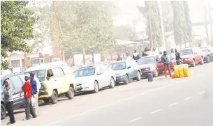  ?? Photo: Shehu K. Goro ?? Motorists queue for petrol at a filling stations in Kaduna yesterday