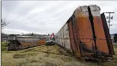  ?? GENE J. PUSKAR — THE ASSOCIATED PRESS ?? Some of the railcars that derailed in East Palestine, Ohio, are in the process of being cleaned up on Feb. 9.