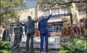  ?? RALPH BARRERA / AMERICAN-STATESMAN ?? University of Texas System Regent Steve Hicks (right) and other officials stand in front of the UT School of Social Work on Wednesday. The school will be renamed in Hicks’ honor.