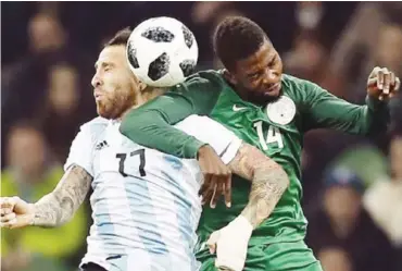 ??  ?? Nigeria’s Kelechi Iheanacho (14) and Nicolas Otamendi of Argentina contest for the ball during a recent internatio­nal friendly match at Krasnodar stadium in Russia