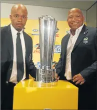  ?? Picture: GALLO IMAGES ?? TROPHY IS OURS: Platinum Stars assistant coach Willem Jackson, left, and Pirates counterpar­t Teboho Moloi yesterday.