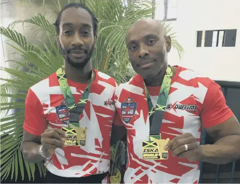  ??  ?? Rob Taylor (right), pictured here with fellow Peterboria­n Kyle Findley after winning a world kick-boxing title in Jamaica, is up for three awards tonight.