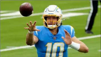  ?? AP Photo/Alex Gallardo ?? Los Angeles Chargers quarterbac­k Justin Herbert pitches the ball during the first half of an NFL football game against the Jacksonvil­le Jaguars on Oct. 25 in Inglewood, Calif.