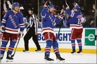  ?? John Minchillo / Associated Press ?? Rangers center Filip Chytil (72) celebrates after scoring on Hurricanes goaltender Antti Raanta during the second period of Game 6 on Saturday.