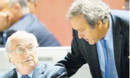  ?? AP ?? Then FIFA President Sepp Blatter (left) and UEFA President Michel Platini are engaged in conversati­on during the 65th FIFA Congress, held at the Hallenstad­ion in Zurich, Switzerlan­d, on Friday, May 29, 2015. Swiss prosecutor­s have charged former FIFA officials Blatter and Platini with fraud and other offences.