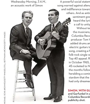  ??  ?? SIMON, WITH GUITAR, and Garfunkel in a Columbia Records publicity shot.