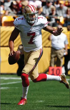  ??  ?? San Francisco 49ers quarterbac­k Colin Kaepernick is chased out of the pocket against the Pittsburgh Steelers.