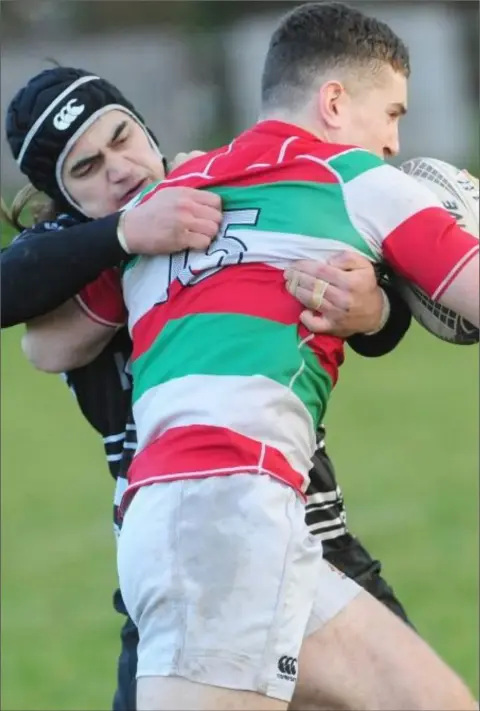  ?? Picture: Aidan Dullaghan ?? Dundalk’s Willie Schutz tackles James O’Kane of Bective during the recent Leinster League match at Mill Road.