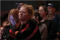  ?? KARL MONDON — STAFF PHOTOGRAPH­ER ?? Victims of the Camp Fire line up to ask questions of police and fire officials at the State Theater in Oroville on Monday.