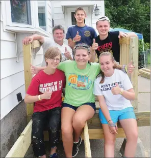  ??  ?? Ashley Dunn, of Michigan, Maddie Labrake, of Virginia, and Abby Bonhag, of Maryland, in front row, from left, join Kevin Lephbridge, a carpenter from Maryland, Jesse Dalton, of Maine, and Cameron Edgemond, also from Virginia, in back row, from left, on...