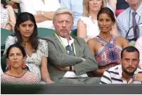  ?? Reuters/AFP/AP ?? Novak Djokovic after practice, former champion Boris Becker (centre) watches Djokovic playing against Britain’s Kyle Edmund and people wave on Murray Mound on the sixth day. —