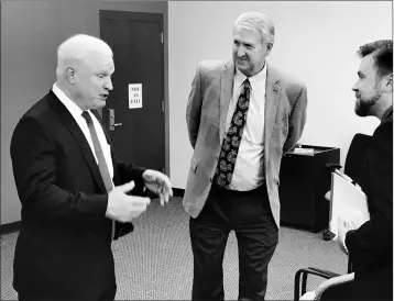  ?? PHOTO BY JAMES GILBERT/YUMA SUN ?? THE HON. ROBERT M. BRUTINEL, Arizona’s new Chief Justice of the Supreme Court, speaks with Presiding Yuma County Superior Court Judge David Haws (middle) and Yuma County Superior Court Commission­er Levi Gunderson at the Yuma County Justice Center as part of his statewide tour announcing his five-year strategic agenda for the state’s court system.