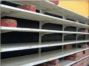  ??  ?? Many shelves had been emptied at the Fort Oglethorpe Walmart by mid-morning Sunday. (Catoosa News photos/Tamara Wolk)