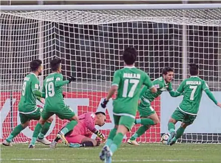  ?? AFC PIC ?? Iraq players celebrate after scoring against Malaysia yesterday.