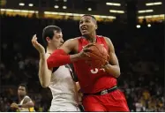  ?? CHARLIE NEIBERGALL — THE ASSOCIATED PRESS ?? Ohio State forward Kaleb Wesson drives against Iowa forward Ryan Kriener on Feb. 20.