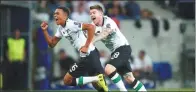  ?? REUTERS ?? Liverpool's Trent Alexander-Arnold (left) celebrates scoring against Hoffenheim in the Reds’ 2-1 win on Tuesday.