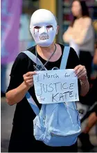  ?? GETTY IMAGES ?? A protestor marches from Town Hall in Sydney as part of an Australiaw­ide March4Just­ice.