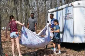  ?? PHOTOS BY MARIAN DENNIS – DIGITAL FIRST MEDIA ?? Persuaded by a classmate, students at Montgomery County Community College helped clean up the Pottstown PAL Sports Complex April 11. They assisted with raking leaves and other various tasks to beautify the facility.