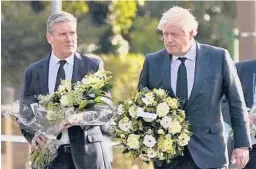  ?? ALBERTO PEZZALI/AP ?? Labour Party leader Keir Starmer, left, and British Prime Minister Boris Johnson arrive Saturday at the scene where David Amess was stabbed to death Friday.