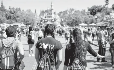  ?? Jay L. Clendenin Los Angeles Times ?? TO KEEP its parks running smoothly and learn more about guests, Disney monitors usage of its smartphone apps and MagicBand.